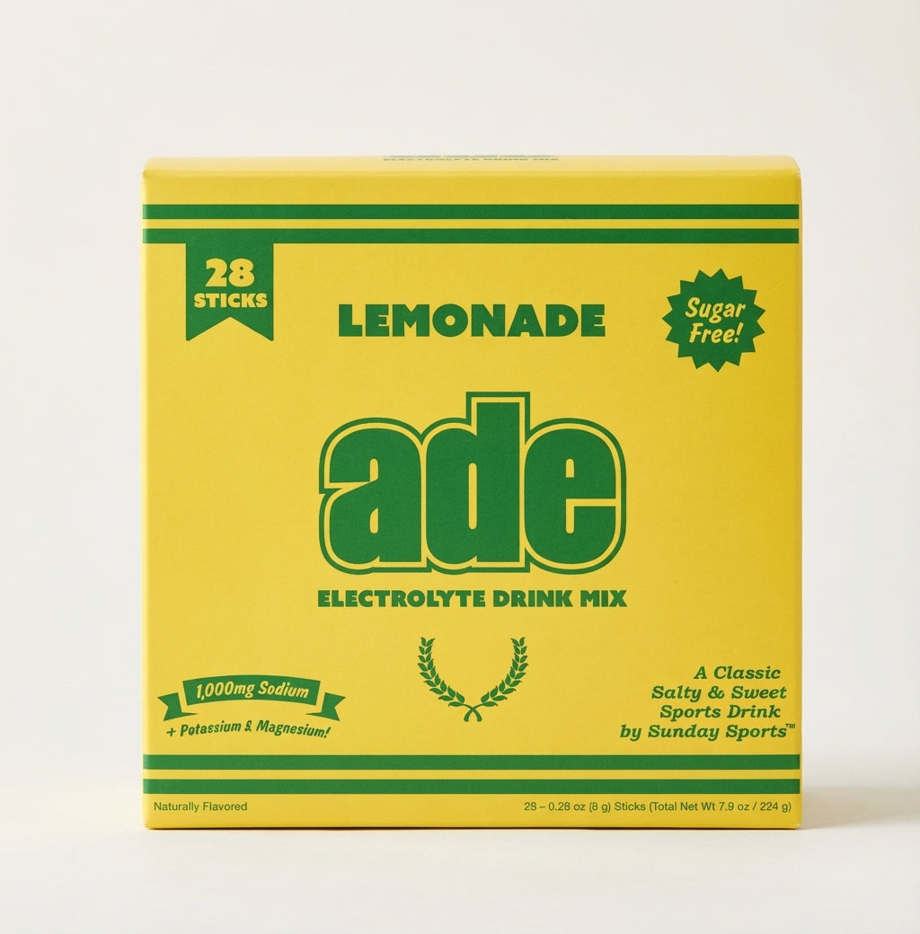 Yellow and green box of ade lemonade electrolyte drink mix on a white background, bundle-box