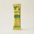Yellow and green package of ade Lemonade electrolyte drink mix on a white background, bundle-selector