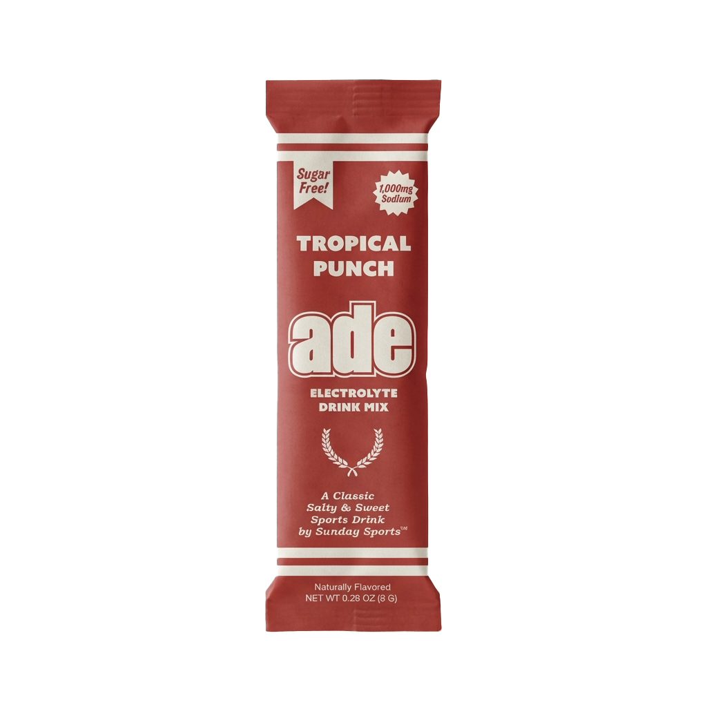 Red package of ade Tropical Punch electrolyte drink mix on a white background